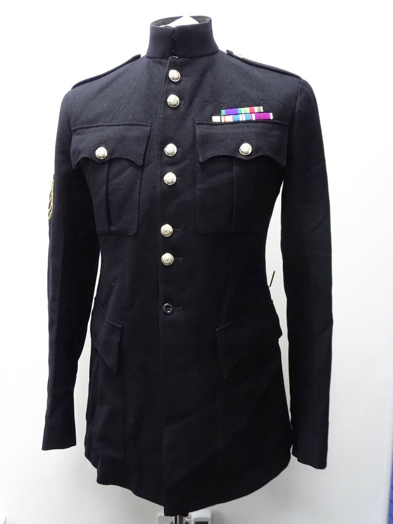 British Army Coldstream Guards No.1 Tunic - Buttoned shoulder epaulettes, stand up collar, four front flapped pockets two with buttons 